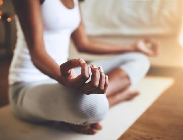 A woman in meditation how to relax at home