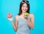 Woman with apple curb food cravings
