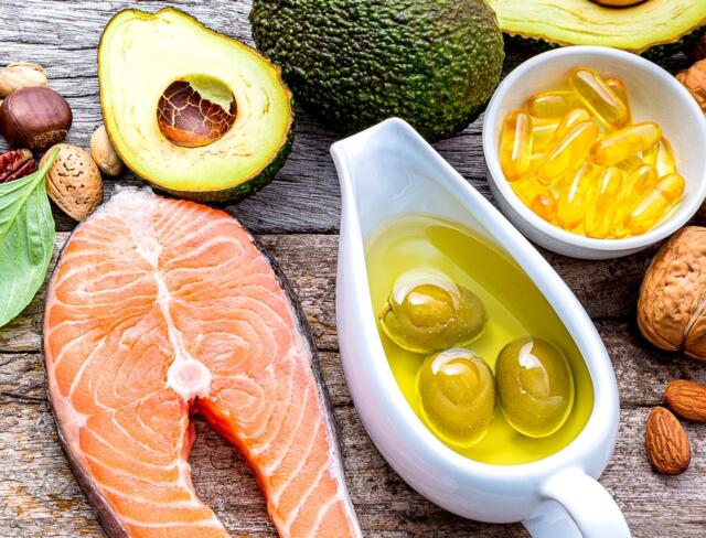 Table with Salmon and avocado Natural Supplements for Beautiful Skin