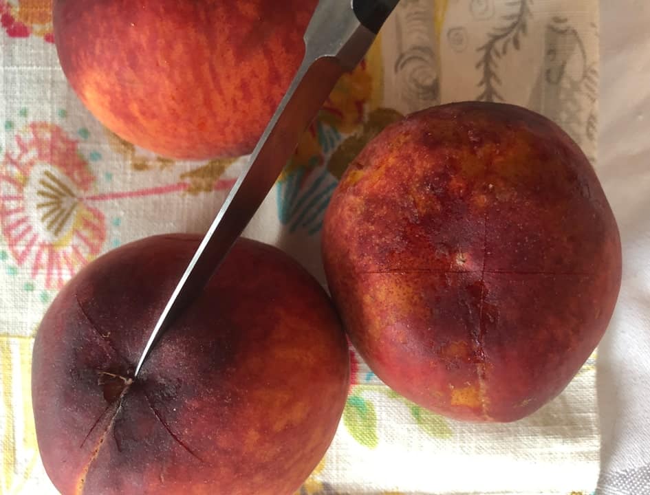 cross slicing peaches before boil